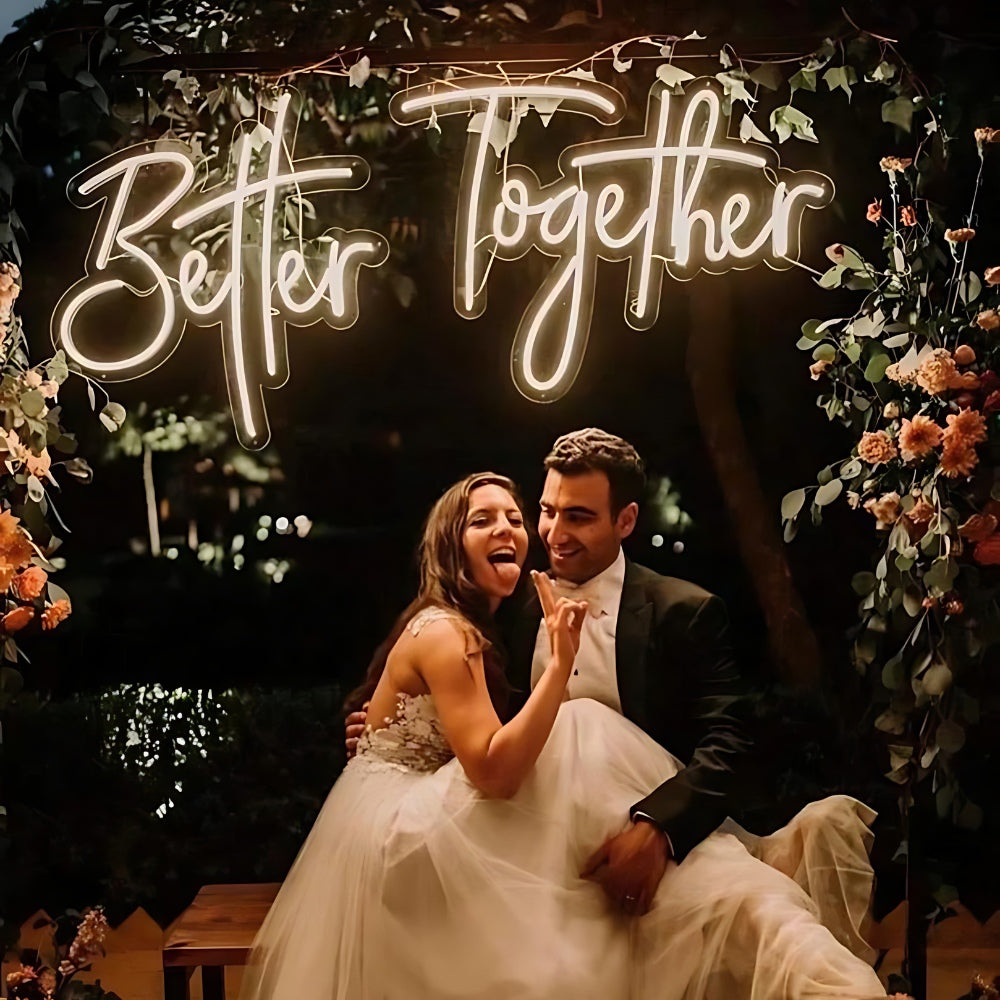 Better Together' illuminated sign at a wedding, adding a romantic touch to the celebration