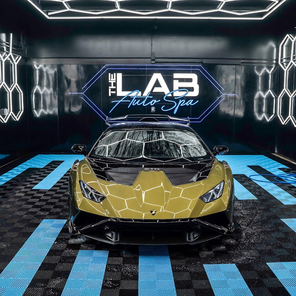 sports car surrounded by a grid of bright hexagon LED lights, creating a dramatic and stylish effect