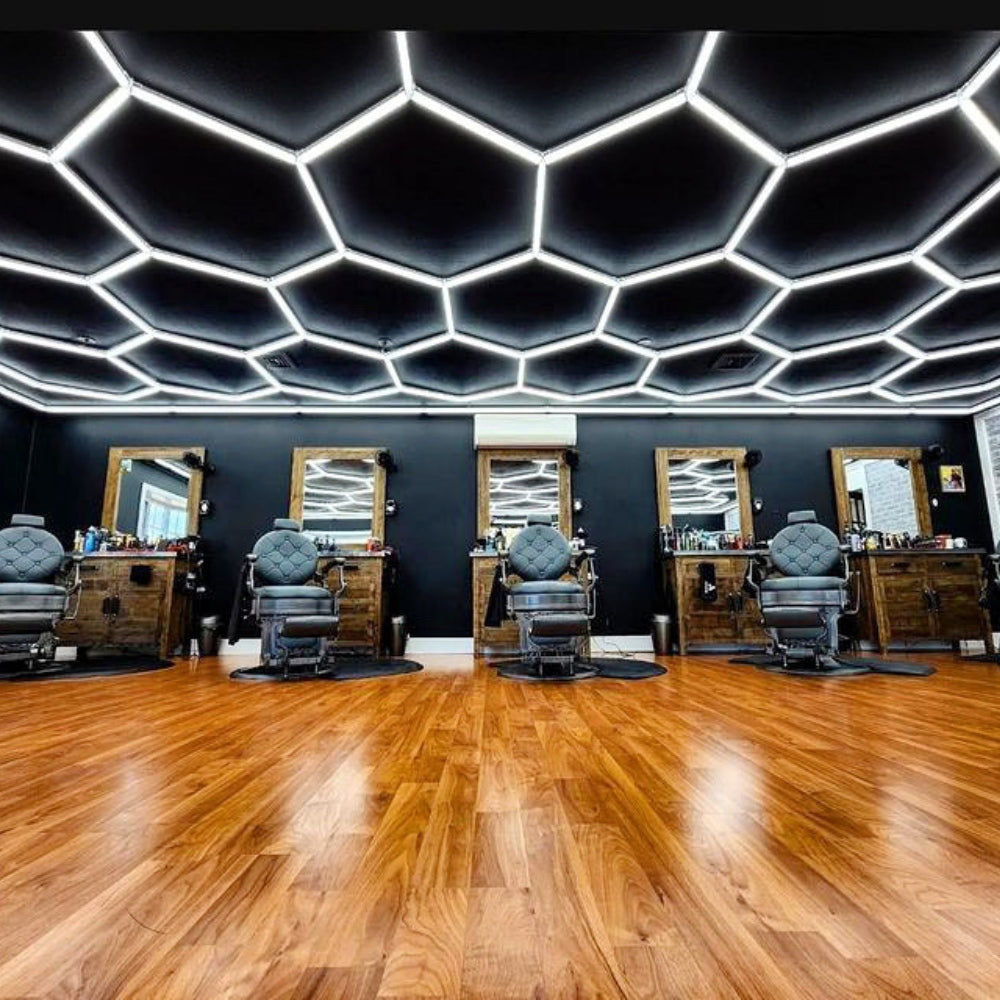 Retail barbershop with hexagon LED grid lights on the ceiling, providing stylish and effective lighting for the space