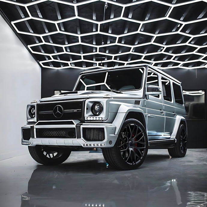 Jeep illuminated from above by a grid of hexagon LED lights, highlighting the vehicle with a modern lighting effect