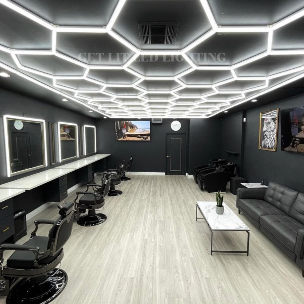 Beauty salon with hexagon LED grid lights and a decorative border on the ceiling, enhancing the salon’s modern aesthetic