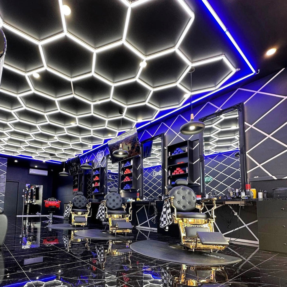 Modern barbershop illuminated by hexagon LED grid lights on the roof, enhancing the retail space with sleek and even lighting