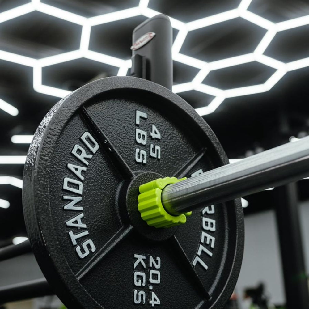 Fitness gym with hexagon LED grid lights on the ceiling, providing bright and energizing illumination for workouts