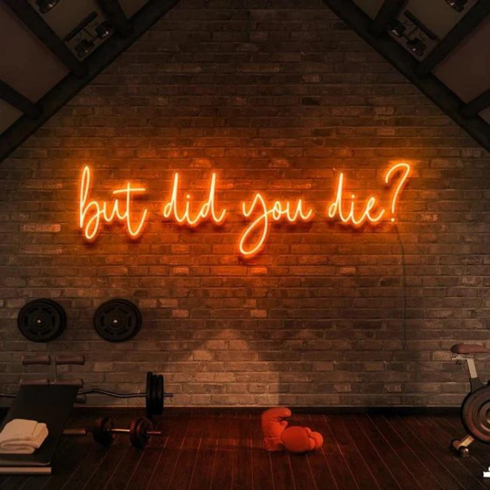 But Did You Die' red neon sign in a gym room, adding a motivational and edgy vibe